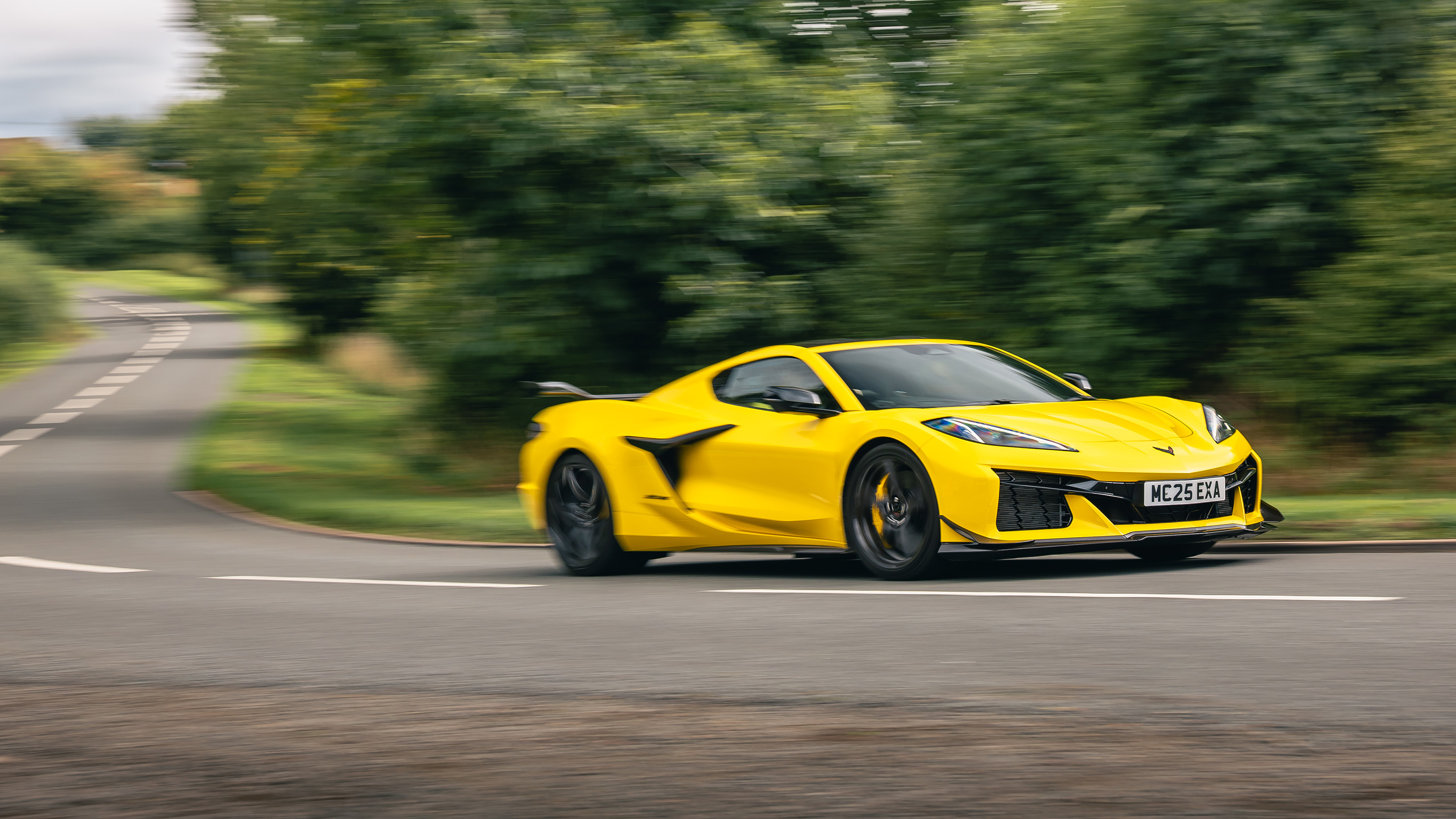 Corvette Z06 yellow cornering front