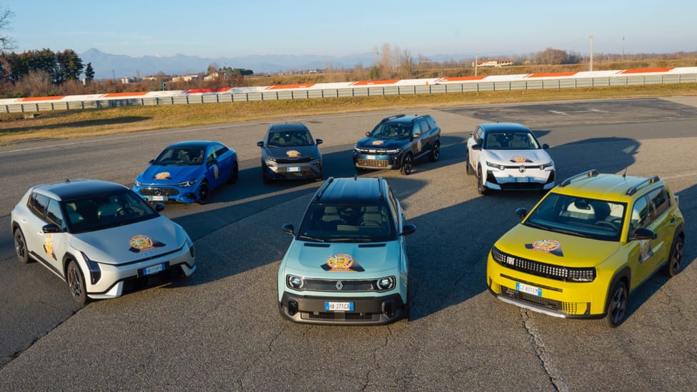 Seven cars pictured on a track