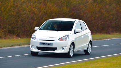 Mitsubishi Mirage driving along a road