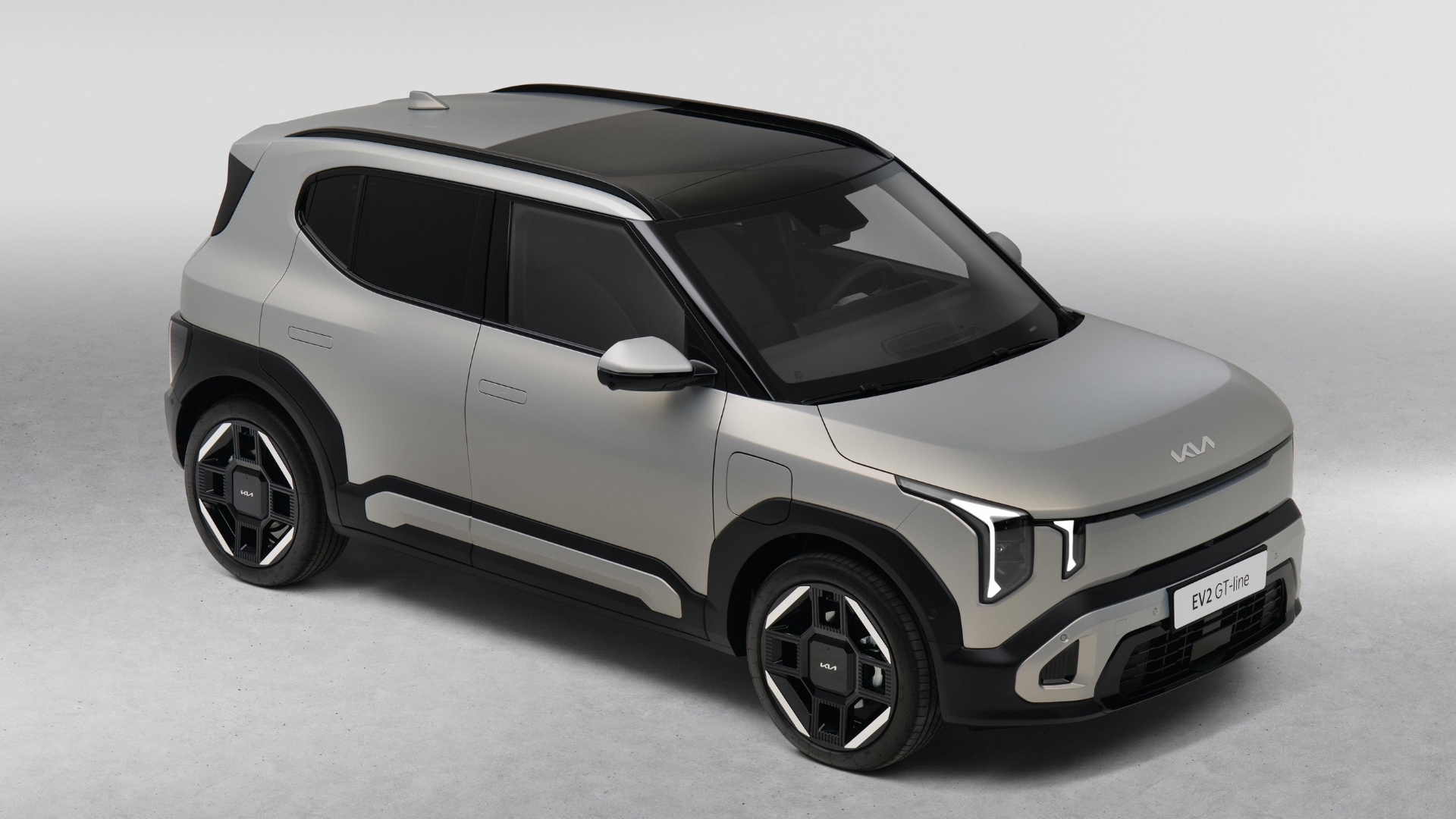 A silver Kia EV2 GT-line on a white background.